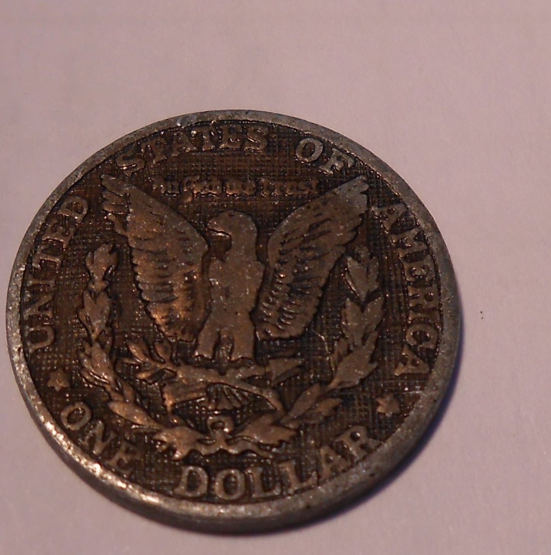  M.28. Jeton d=19 mm, mit der Abbildung der Rückseite eines Morgan Dollars   