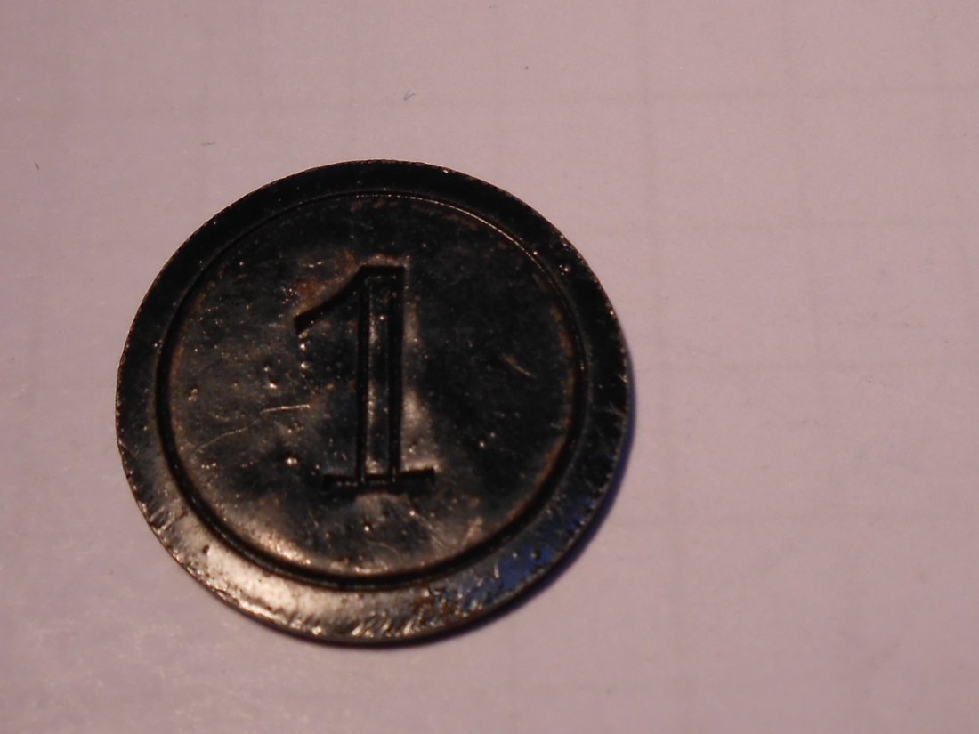  T:8.1 Wertmarke unbekannt, auf der Vorderseite eine eingestanzte 1, auf der Rückseite der Schriftzug   