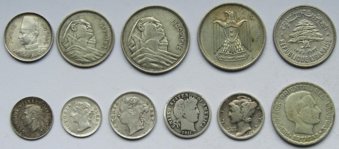  Lot aus elf Silbermünzen aus aller Welt, zusammen 31,9 g Feinsilber   
