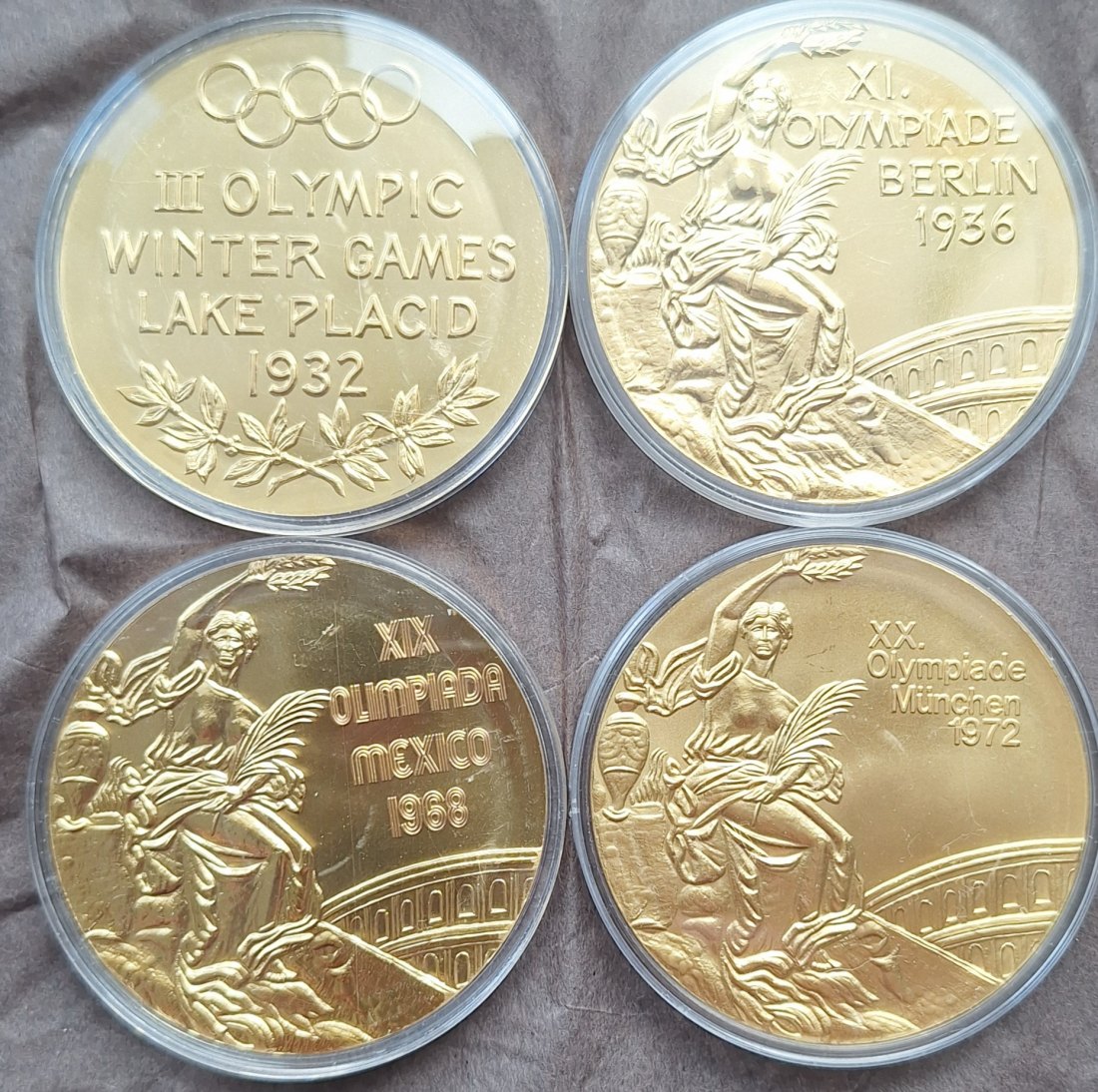 4 verschiedene Medaillen Olympische Spiele - siehe Bilder unedel gekapselt