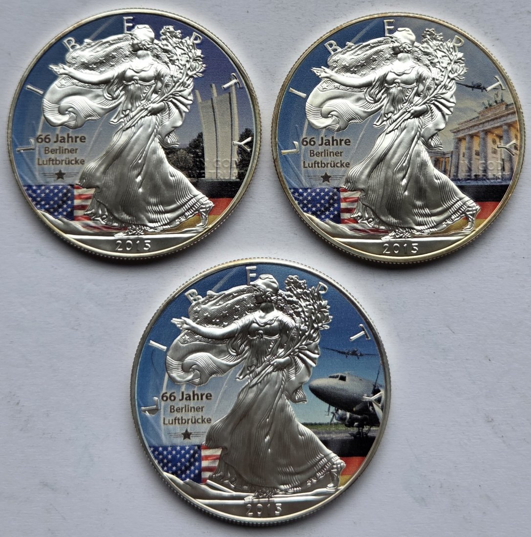 Drei kolorierte Silberunzen 66 Jahre Luftbrücke 2015, zusammen 93,3 g Feinsilber   